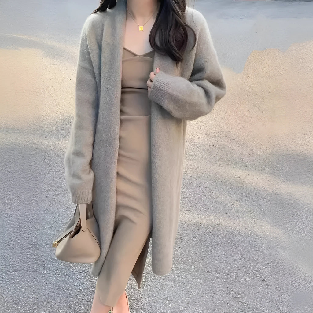 Women's khaki knitted V-neck cardigan with long sleeves, shown on a model.