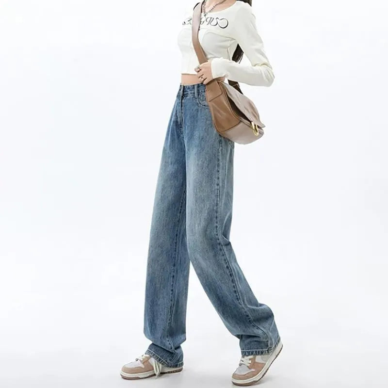 Woman wearing retro blue high-waisted wide-leg jeans with a straight-leg cut.
