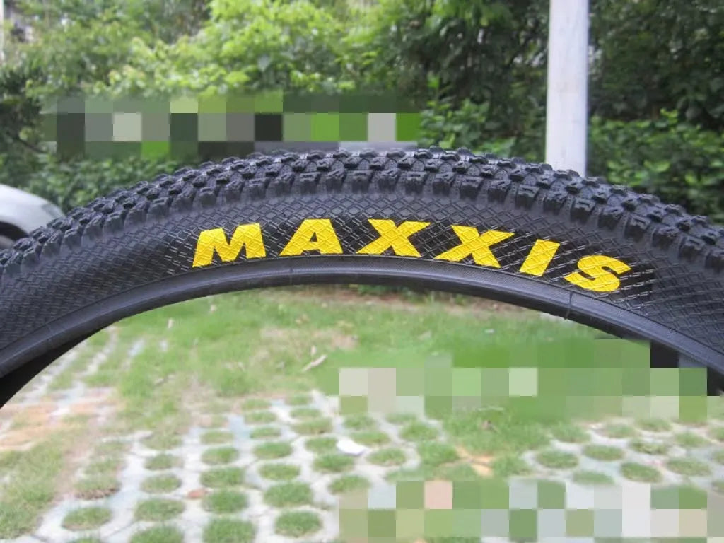 Ultralight puncture-proof mountain bike tyre showing tread pattern and sidewall in available sizes