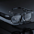 Black head-mounted smart Bluetooth glasses for video recording on a stand