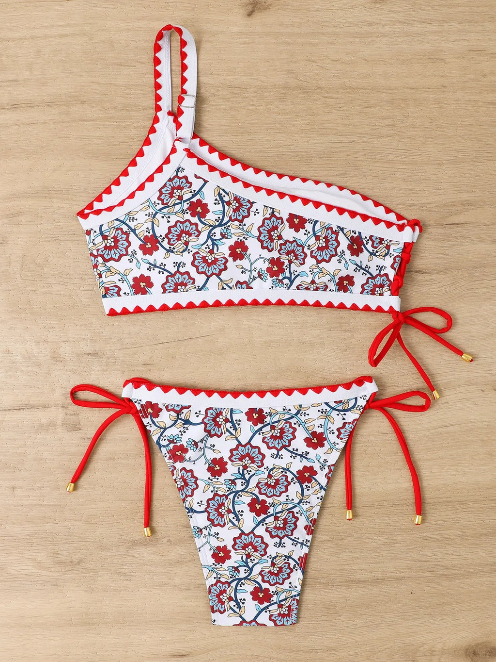Blue one-shoulder floral bikini set with brief bottoms on mannequin