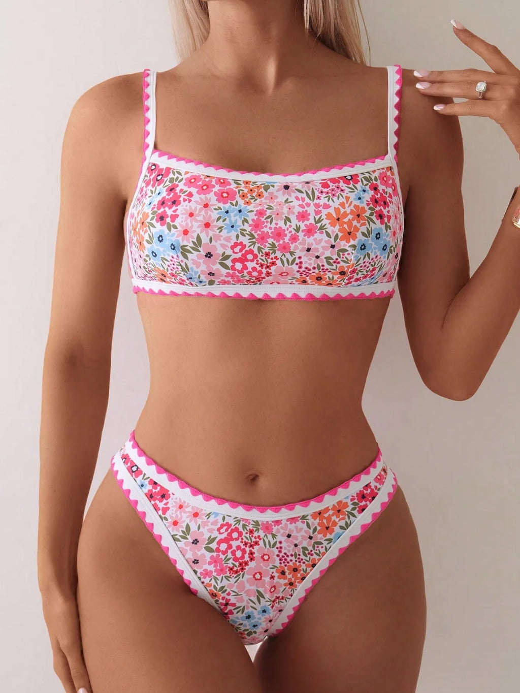 Women's printed lace-up bikini swimsuit with split briefs on a mannequin.