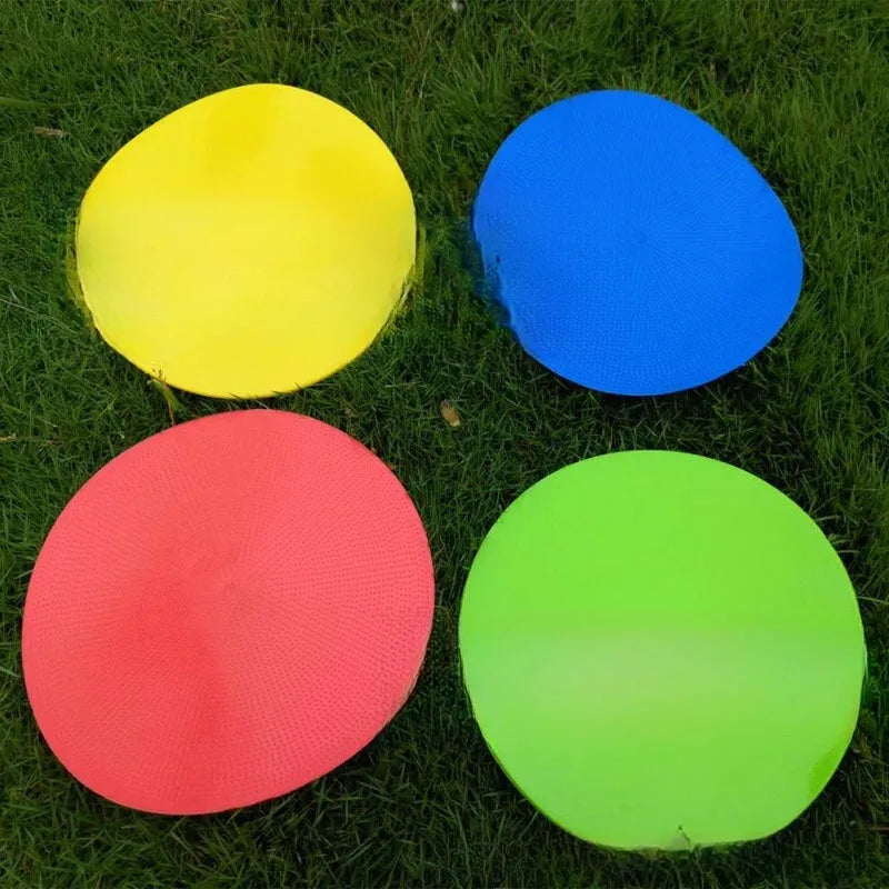 Yellow TPE football landmark pad disc on grass, 23cm diameter flat sports training marker.