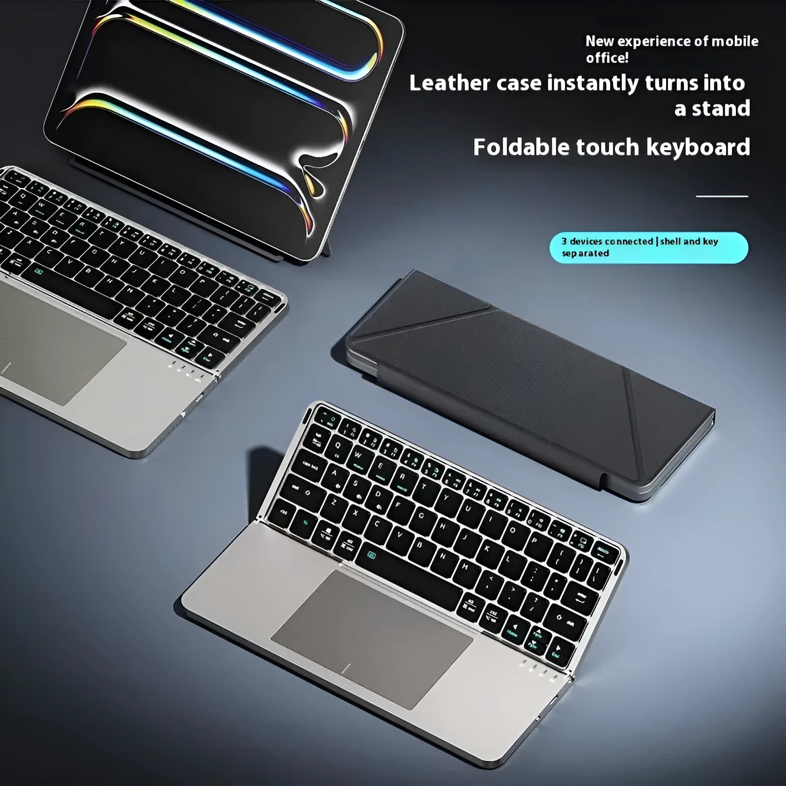 Grey wireless Bluetooth folding keyboard for mobile phones and tablets on a table.