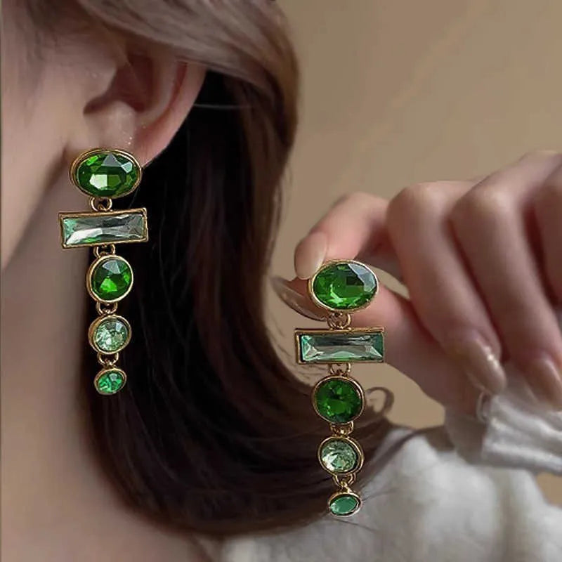 A pair of retro green gradient alloy earrings with a geometric tassel shape and inlaid zircon details.