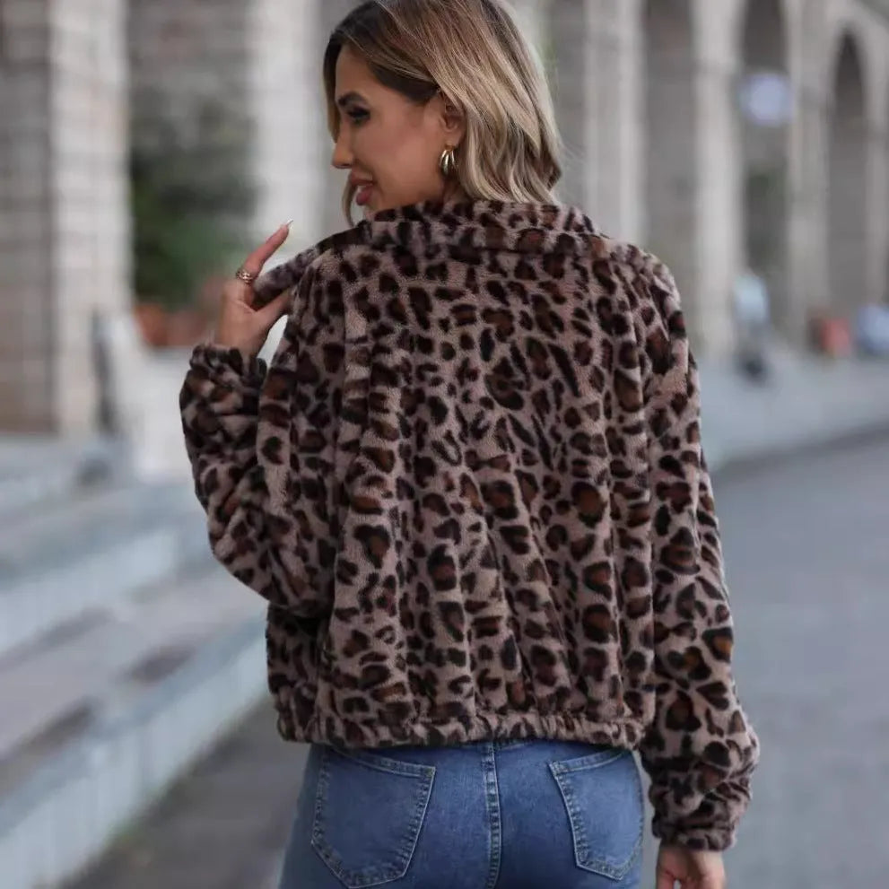 Women's loose fit leopard print plush coat with zip front and raglan sleeves.
