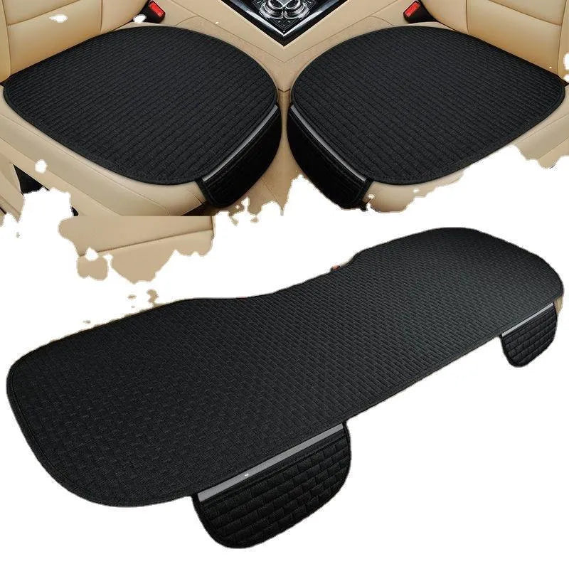 Linen car seat cushion with plaid pattern and hemmed edges in classic black and red colour
