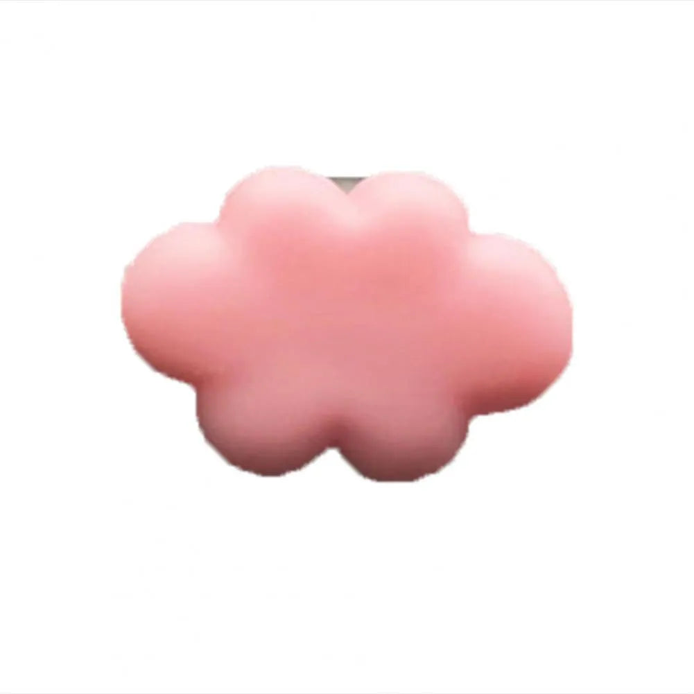 Resin Baiyun cartoon car fragrance clip in light green colour attached to a car air vent