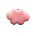 Resin Baiyun cartoon car fragrance clip in light green colour attached to a car air vent