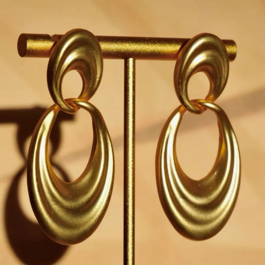 French retro style copper earrings with a U-shaped double circle design in a gold and quicksand finish.
