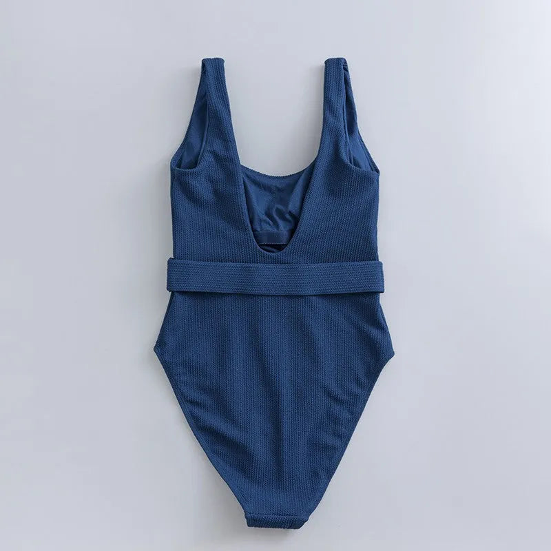 Navy blue women's one-piece slimming swimsuit with triangle neckline and removable chest pad.