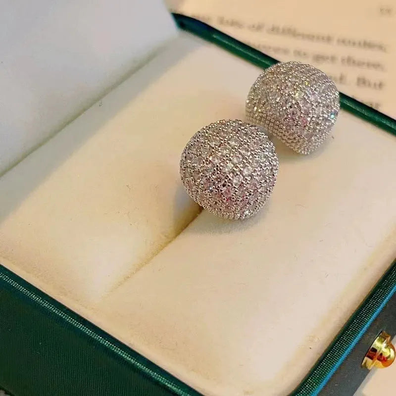 Golden beans shaped clip earrings with diamond crystals in drop geometric design
