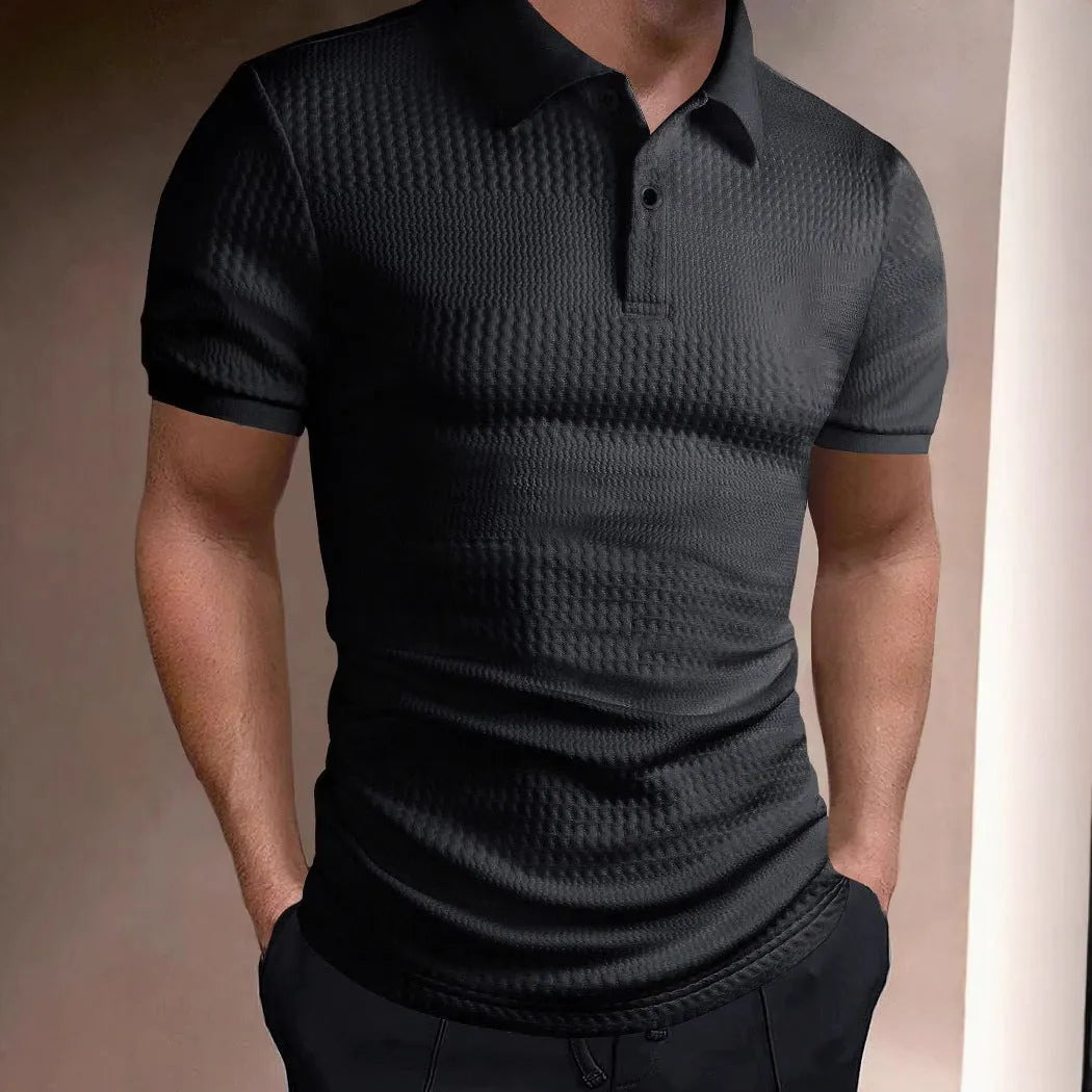Man wearing a striped loose-fit polo shirt in a light blue colour, suitable for business casual summer wear.