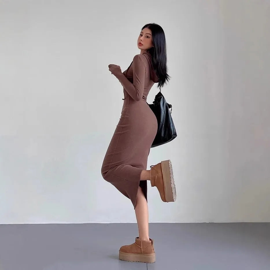 Women's grey hooded sheath dress with long sleeves and a high waist, shown in a front view.