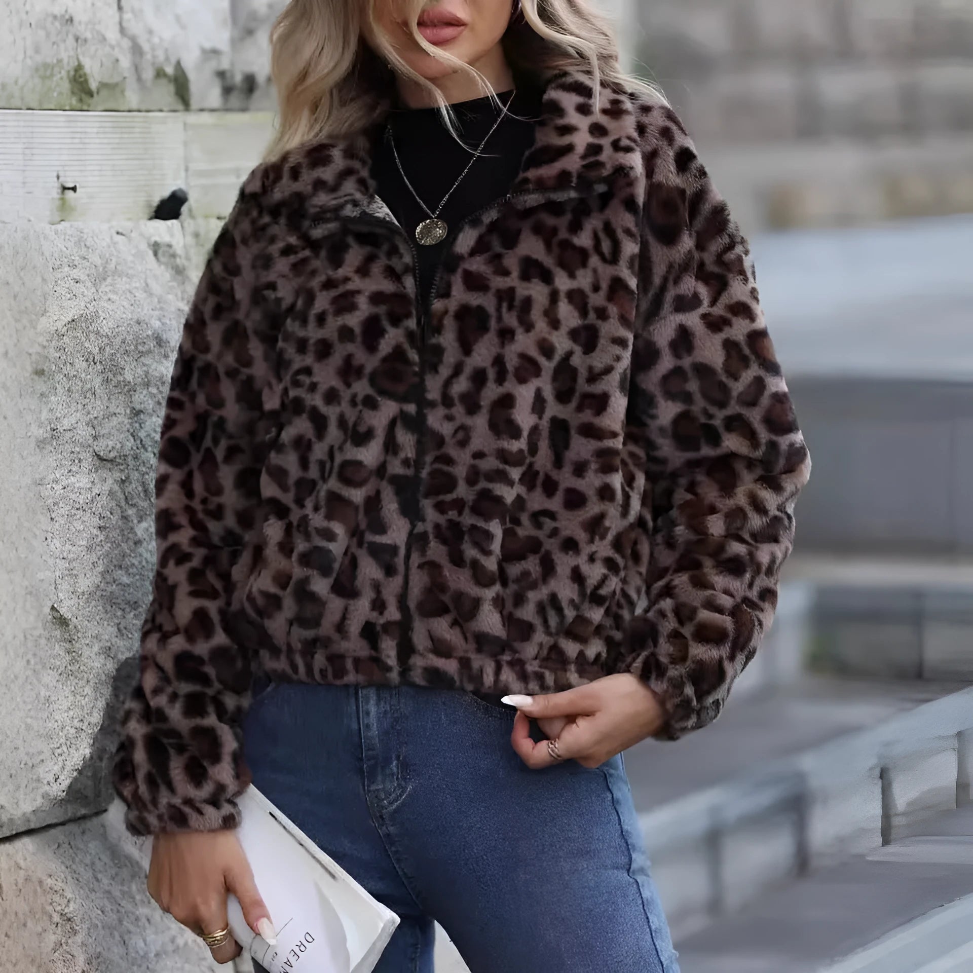 Women's loose fit leopard print plush coat with zip front and raglan sleeves.