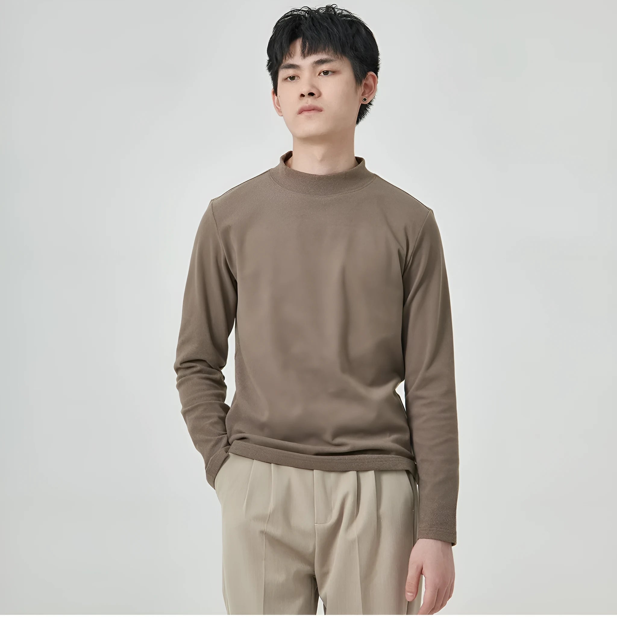 Men's solid colour Dralon half-high collar long sleeve t-shirt on a hanger.