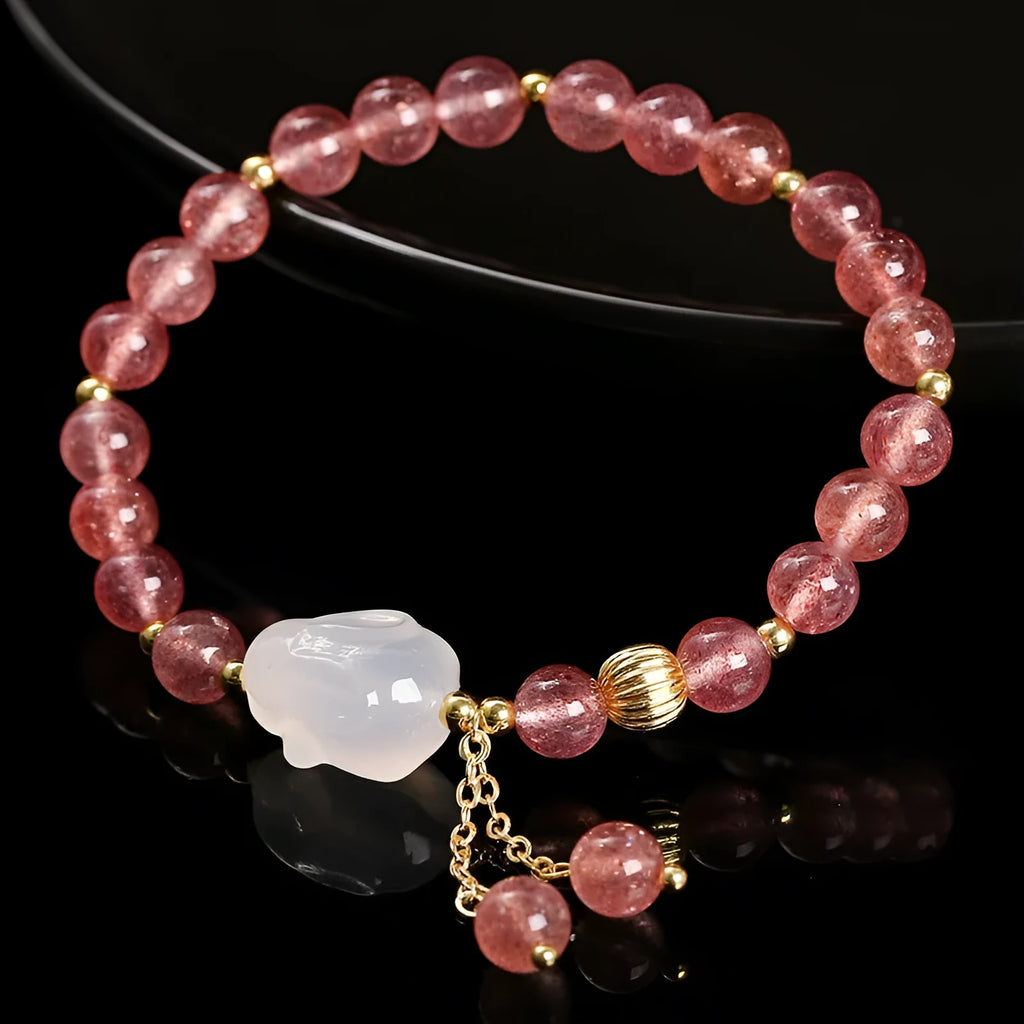 Natural strawberry quartz and agate bracelet for women with 6mm round beads and a white rabbit charm.