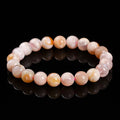 Natural cherry agate bracelet with round geometric beads in a sweet style for women.