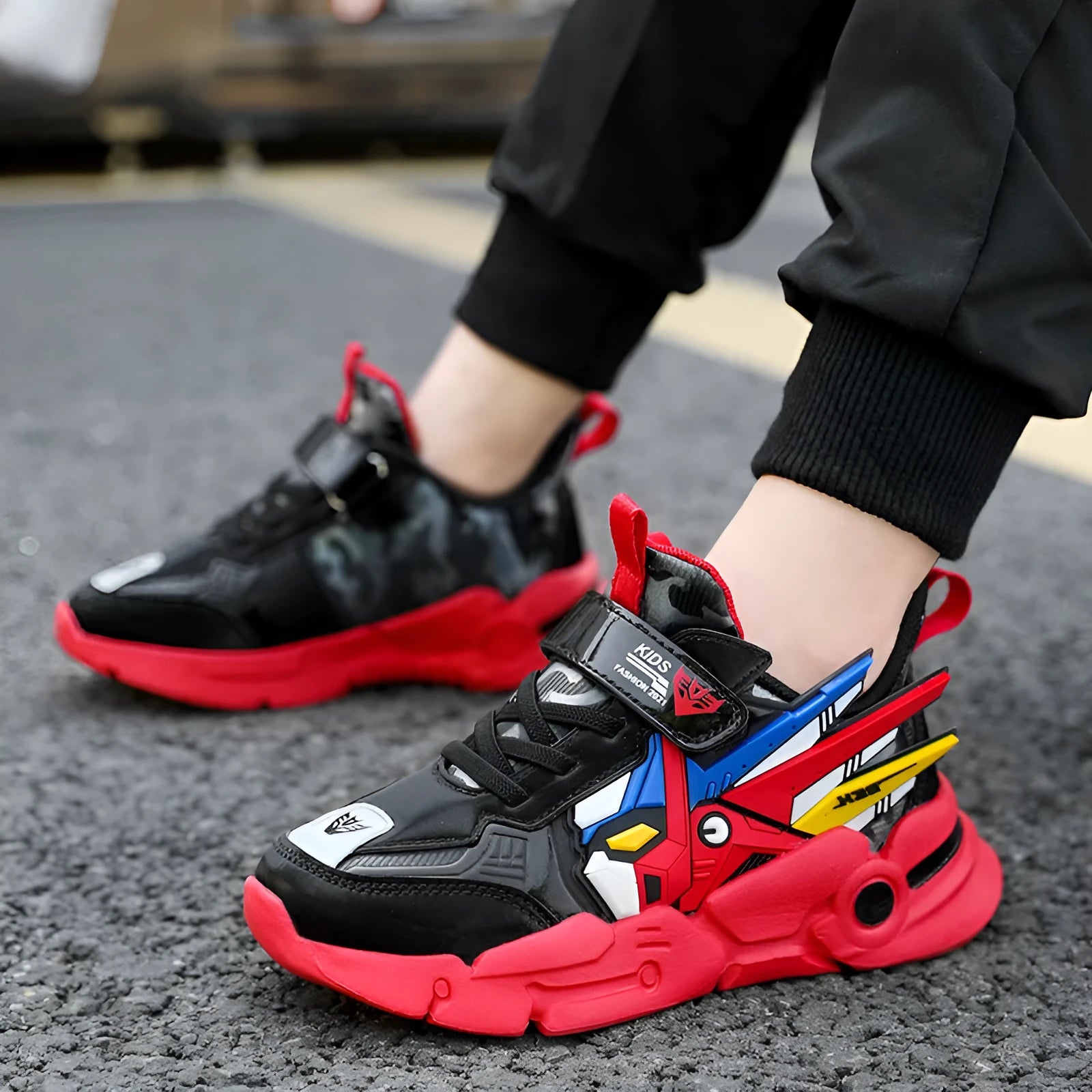 Boys yellow artificial leather sneakers with Velcro strap and cartoon pattern, on a rubber sole.