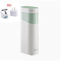 Compact black or green desktop instant water dispenser with digital display on a wooden table.