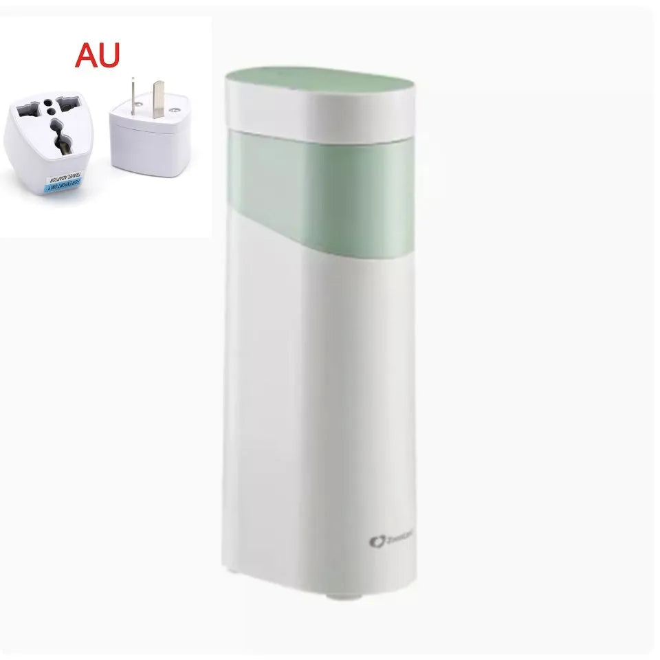 Compact black or green desktop instant water dispenser with digital display on a wooden table.