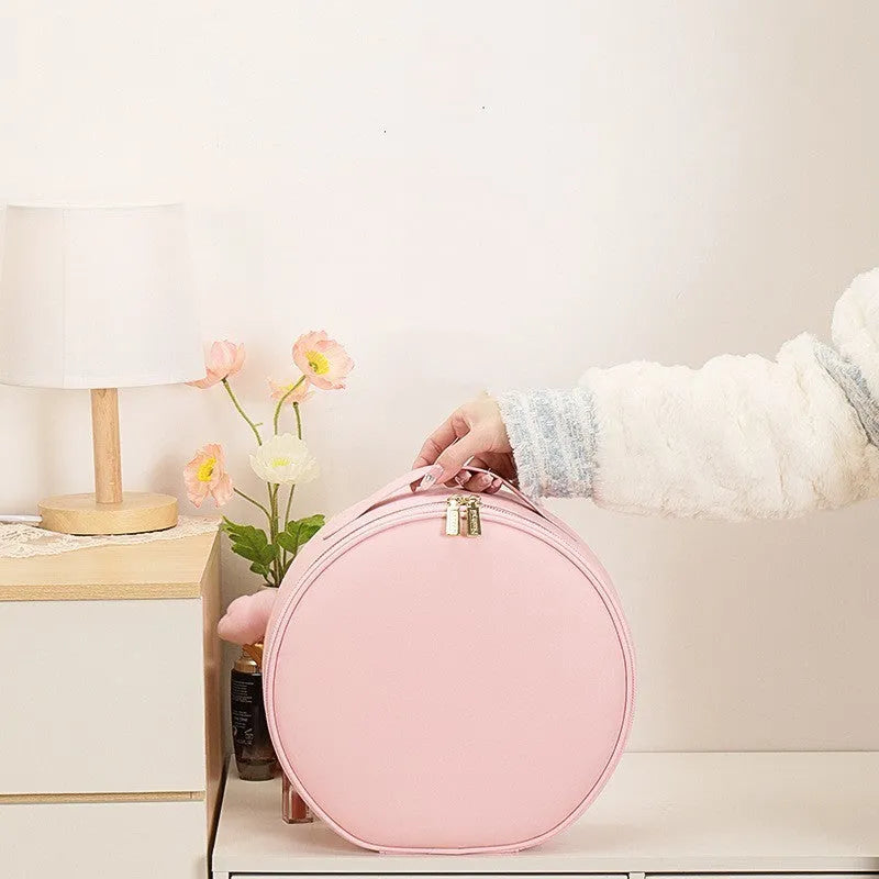 Round cherry blossom pink PU leather makeup bag with a lit LED mirror inside, showing internal partitions.