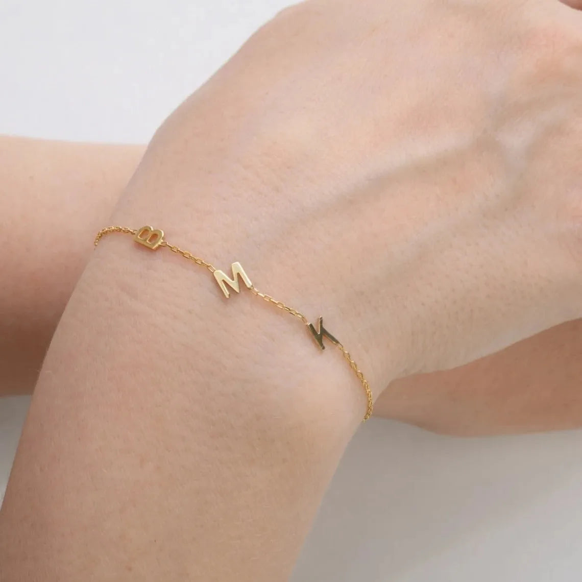 Gold stainless steel custom name bracelet with heart charm and personalised initials