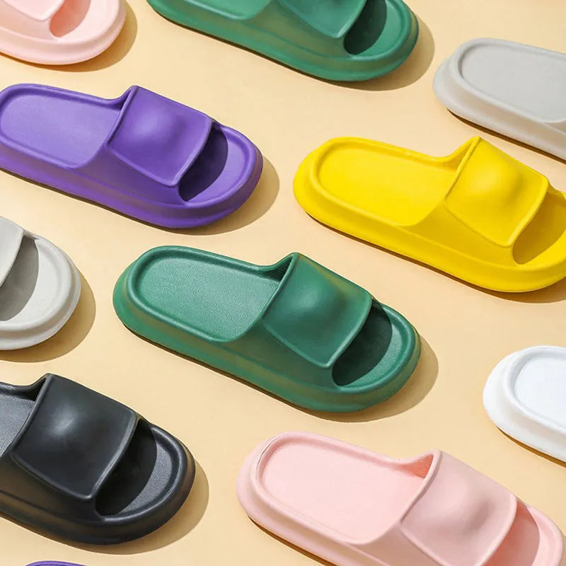 Unisex thick-soled EVA flip flop slippers in multiple colours on a white background.
