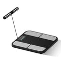 Black electronic weighing scale with tempered glass platform showing body fat percentage on colour screen