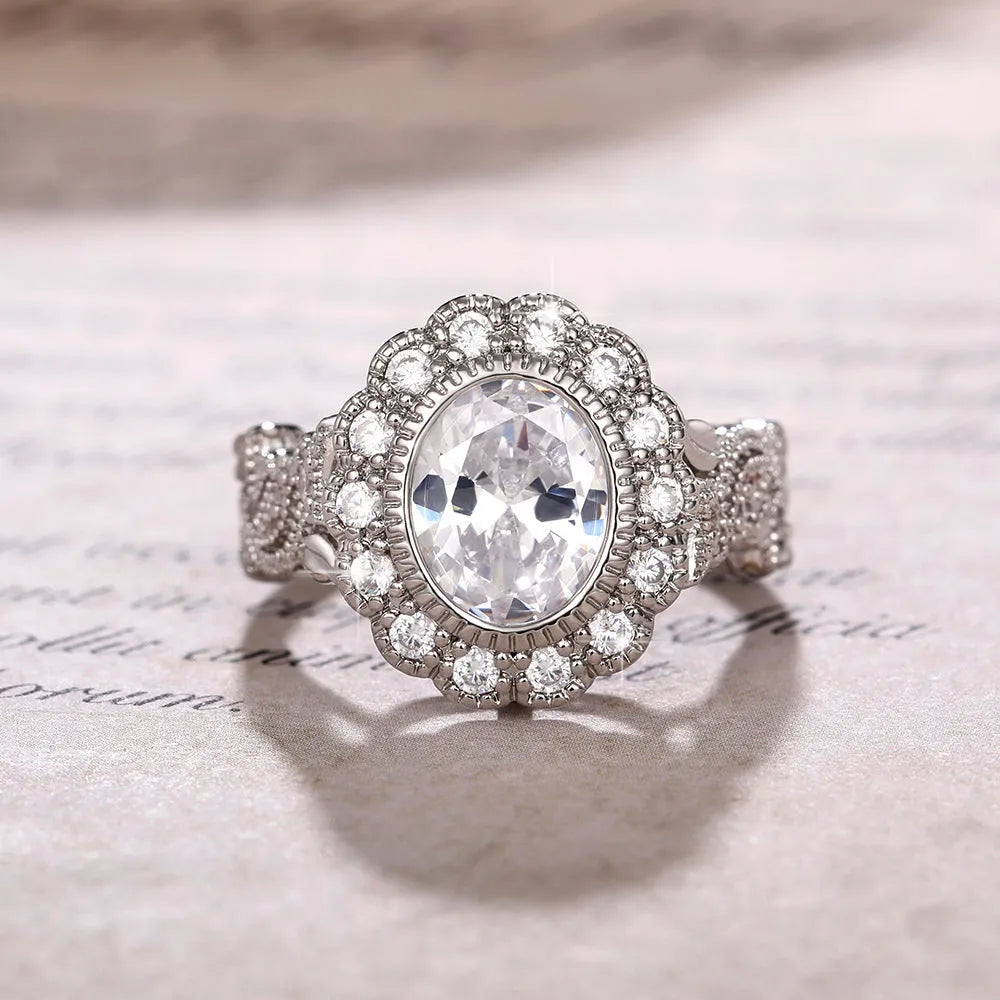 Geometric white gold plated copper ring with round zircon centrepiece on finger