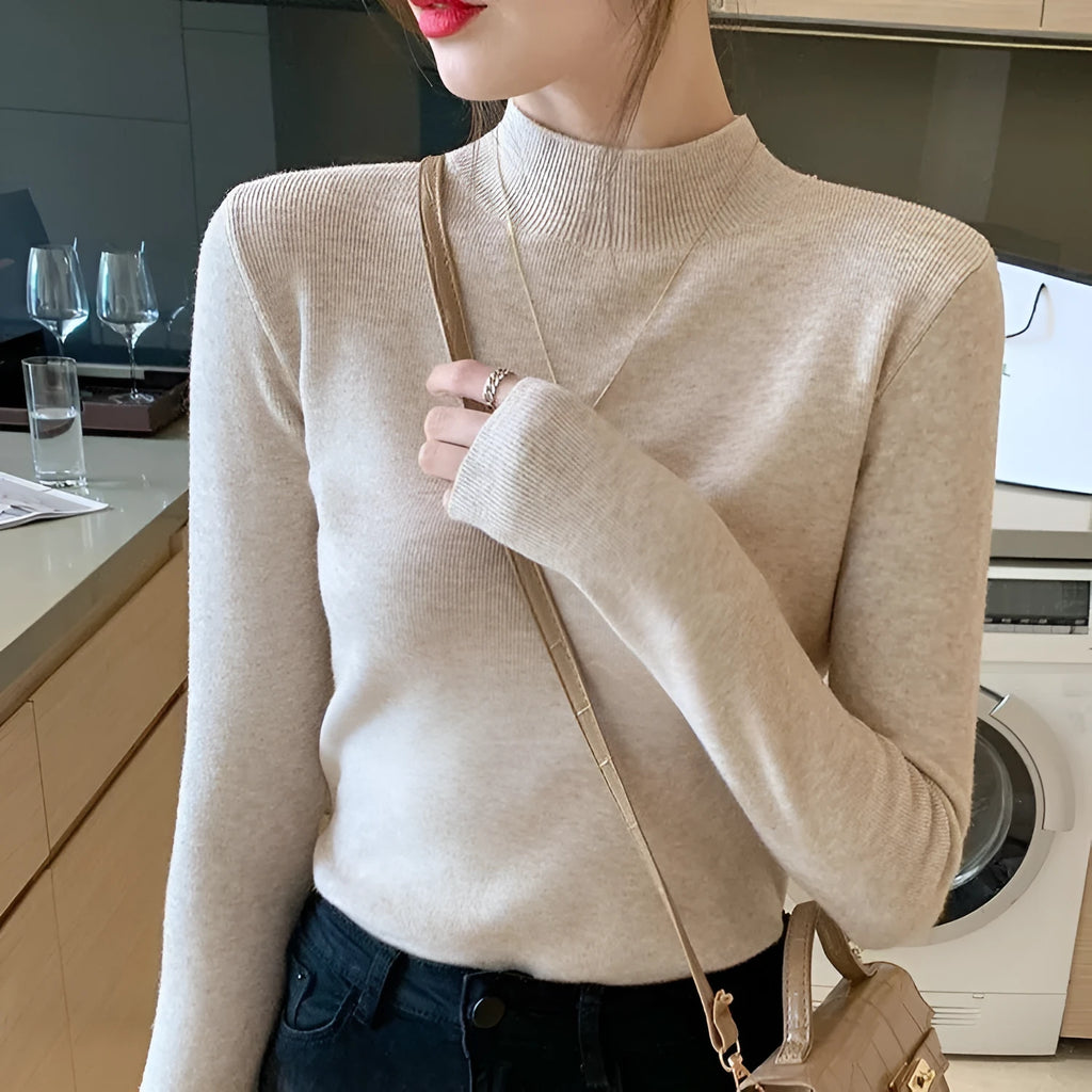 Slim fit viscose long sleeve top in apricot colour showing inner knitted bottoming detail.