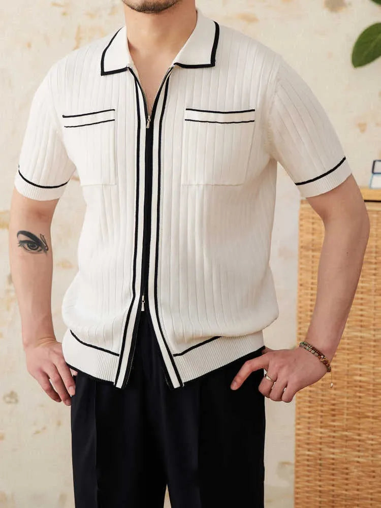 A black lapel short-sleeved knit polo shirt laid flat, showing the collar and slim fit.