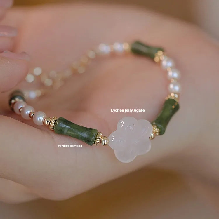 Chinese style olivine bracelet with Hetian jade and copper shell pearls featuring bamboo joint design