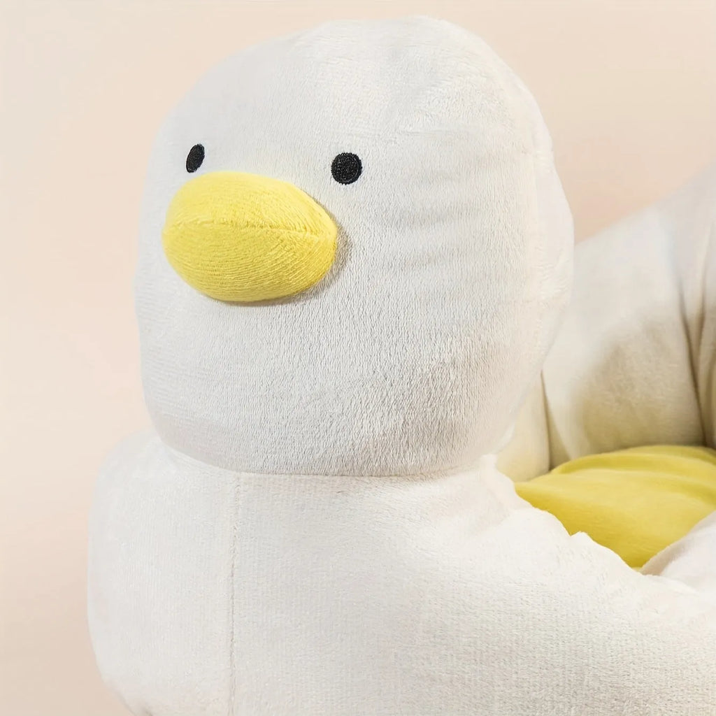 Blue duck-shaped fluffy pet bed sofa for a small dog, showing raised sides and soft material.