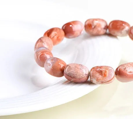 Natural cherry agate barrel bead bracelet with 10x14mm ruyi motifs geometric design