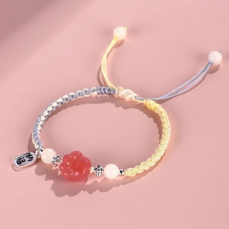 Handmade red cat's paw charm bracelet with woven band in pink or yellow colour for couples