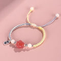 Handmade red cat's paw charm bracelet with woven band in pink or yellow colour for couples