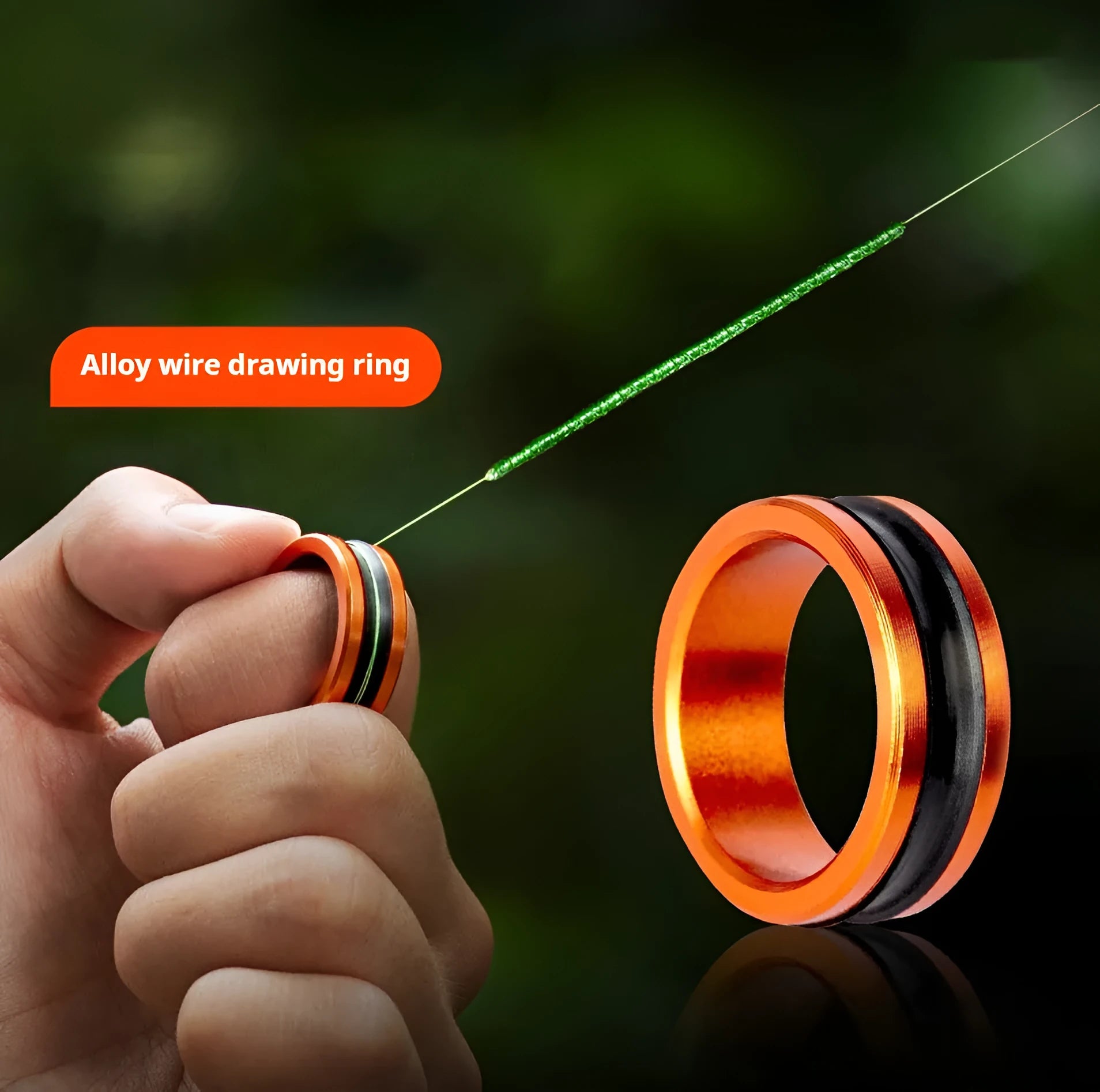 Orange and silver alloy fishing hand guard tool with non-slip surface and pull loop
