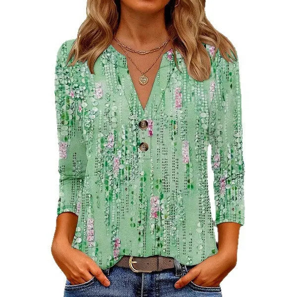 Loose fit women's V-neck T-shirt with a colourful 3D printed pattern on the front.