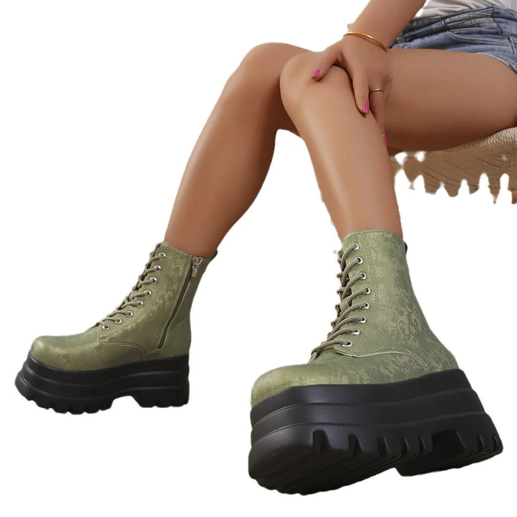 Women's white retro platform Martin boots with patchwork detail and a side zip.