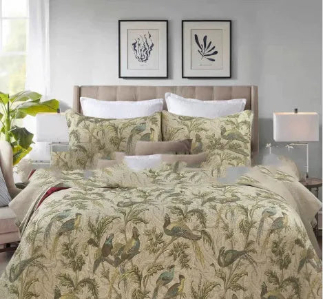 Blue American-style floral and bird quilted cotton bedspread set on a bed, showing its 230x250 cm size.