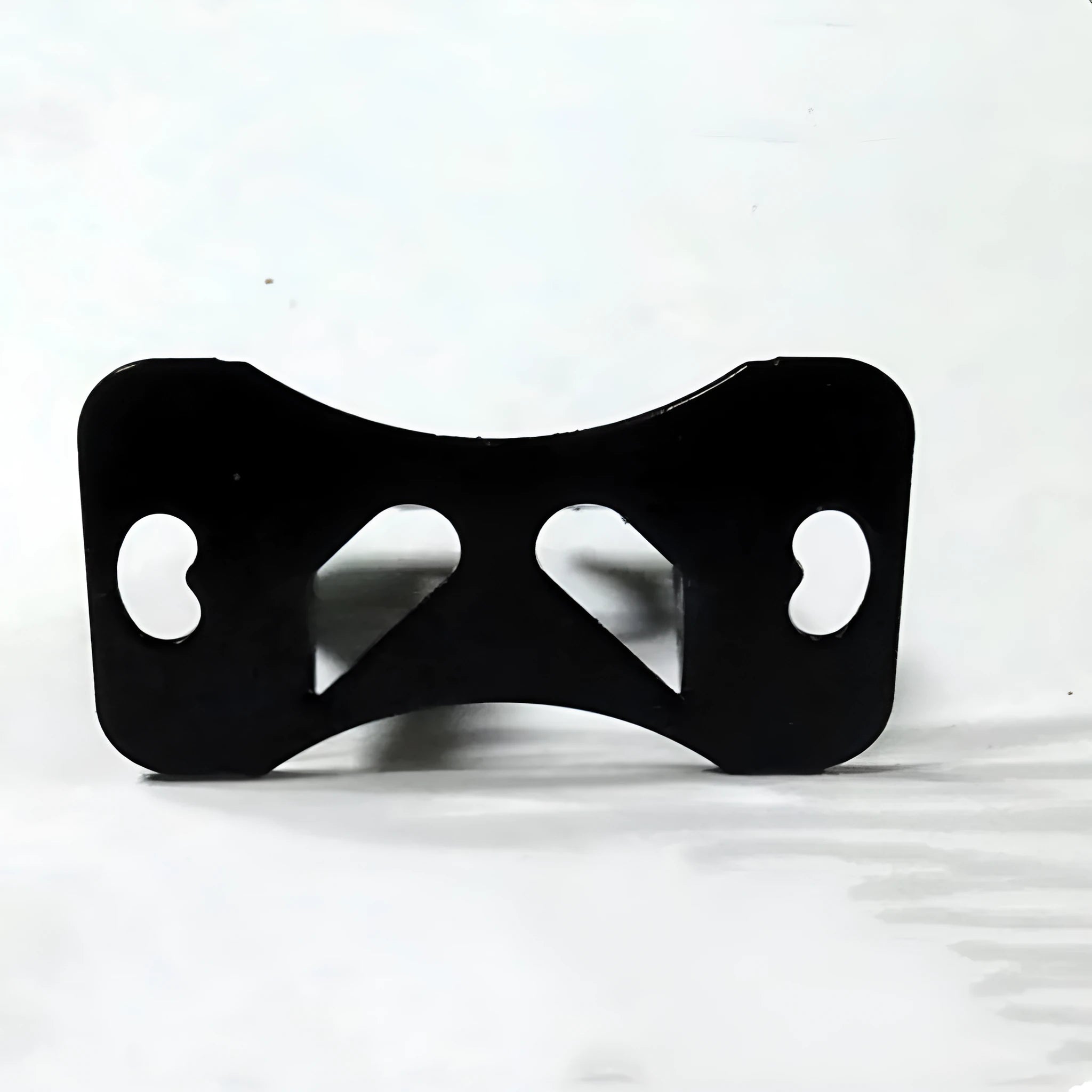 Black metal universal in-car camera holder with adjustable angle on a car windscreen.