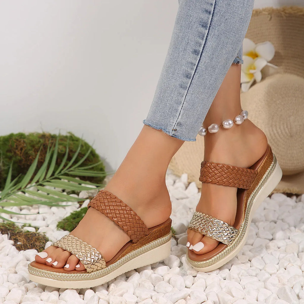 Gold wedge sandals for women with an adjustable ankle strap and a rubber sole.