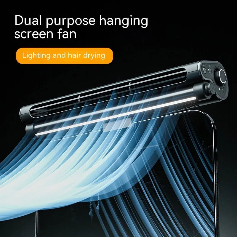 Black USB-powered bladeless clip-on fan with integrated lighting lamp attached to a laptop screen.