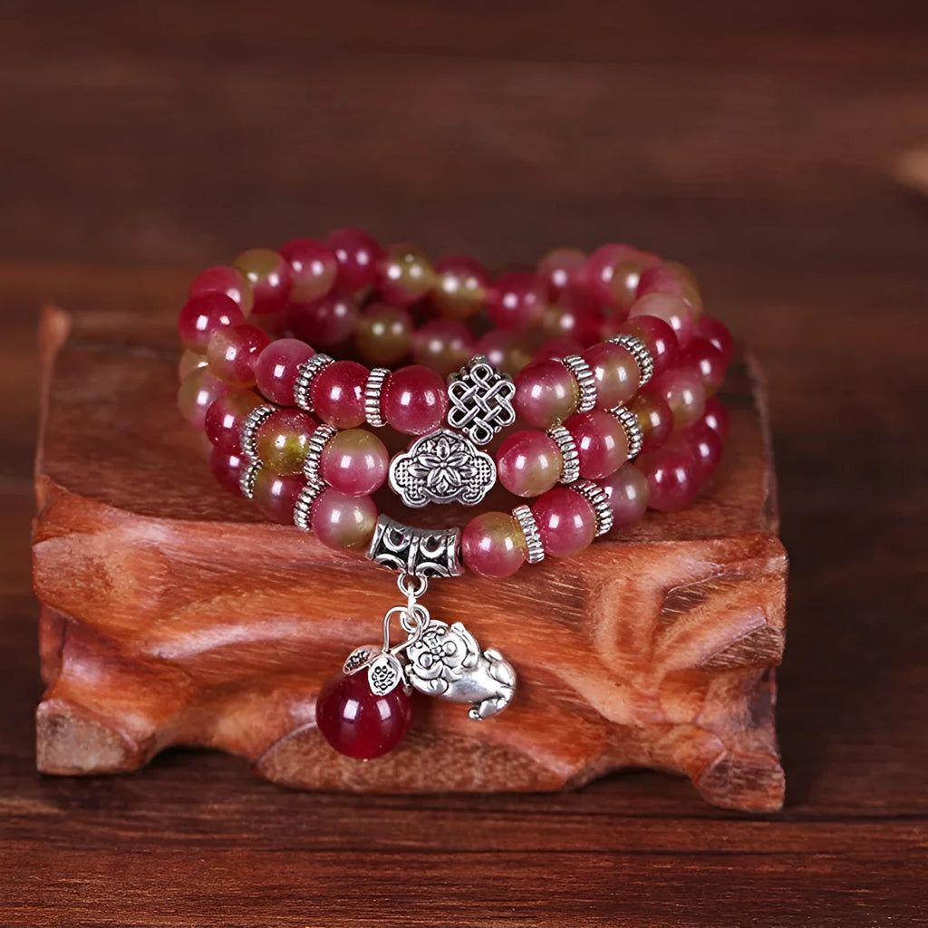 Handmade natural watermelon crystal bracelet with Chinese knot design and geometric beads in elephant style colours