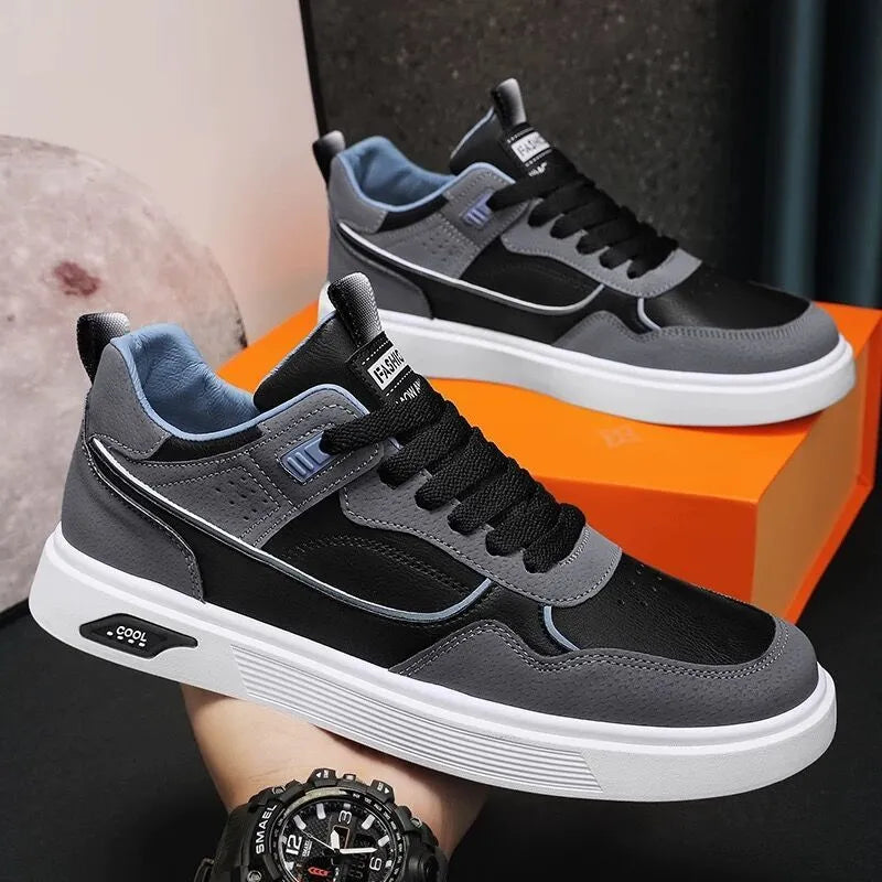 Men's low-top canvas board shoes in black, beige, or grey with round toe and leather stitching.