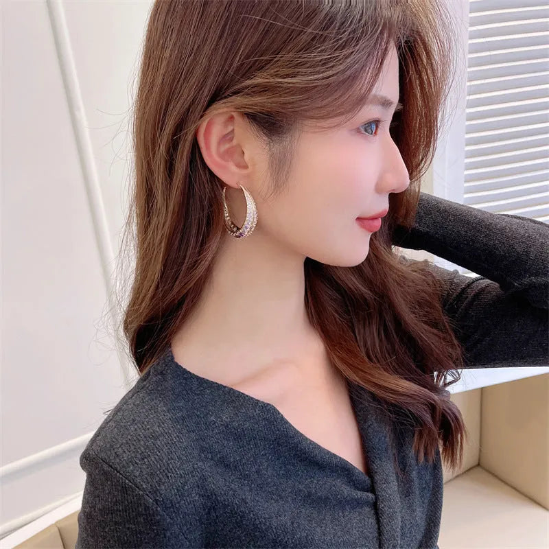 Geometric copper hoop earrings for women in gold, purple, green, black or silver electroplated colours, showing 4.3cm by 4.5cm size.