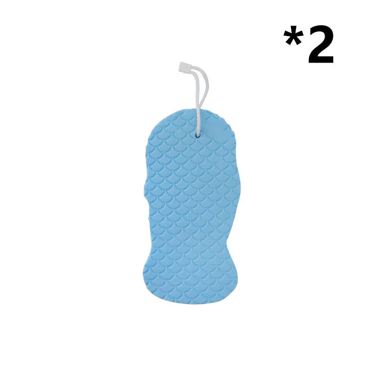 White 3D fish scale pattern bath sponge ball for gentle body exfoliation in the shower.