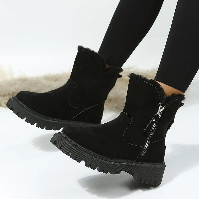 Women's black thick plush snow boot with side zipper and round toe on a rubber sole.