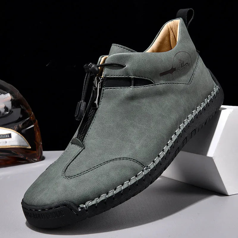 Men's black casual leather shoes with a round toe, tall crown, and a rubber sole.